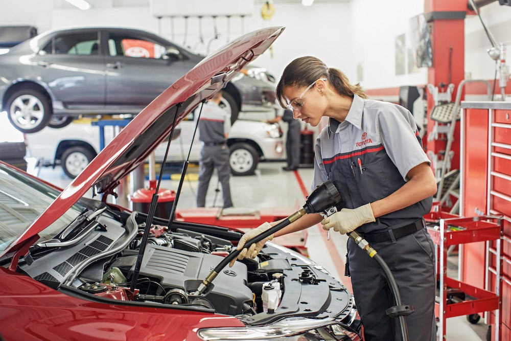 ToyotaCare in Hollidaysburg at Fiore Toyota | Toyota technician inspecting car engine