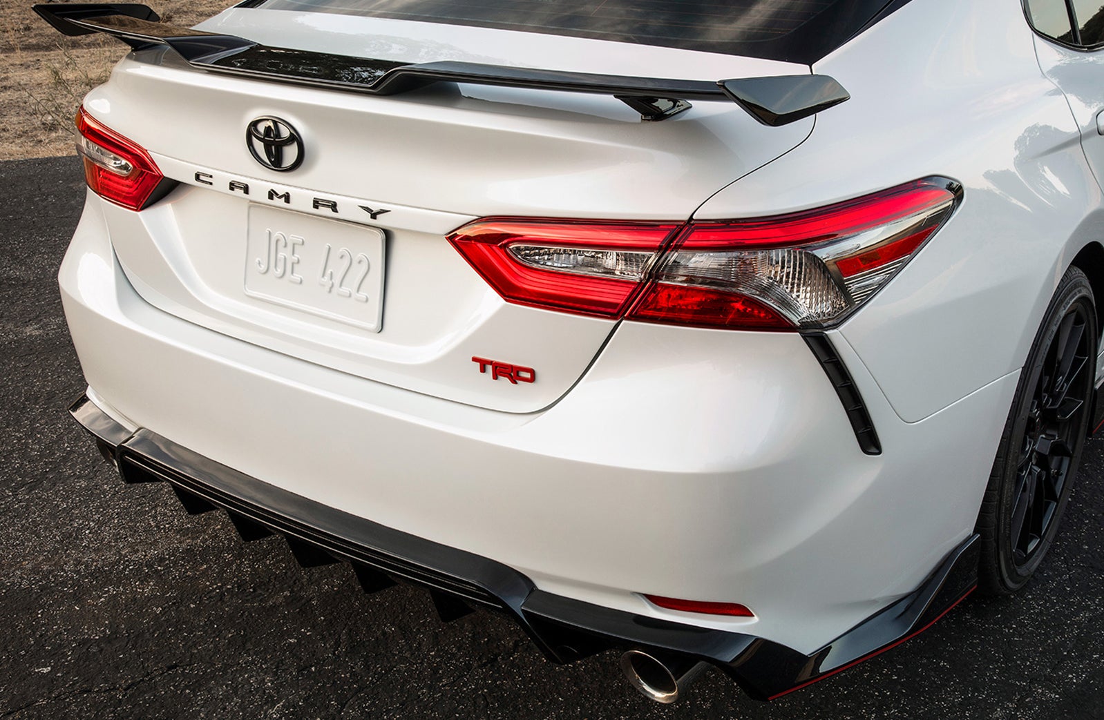 2020 Toyota Camry versus 2020 Honda Accord Comparison at Fiore Toyota | The tail end of the white 2020 Camry