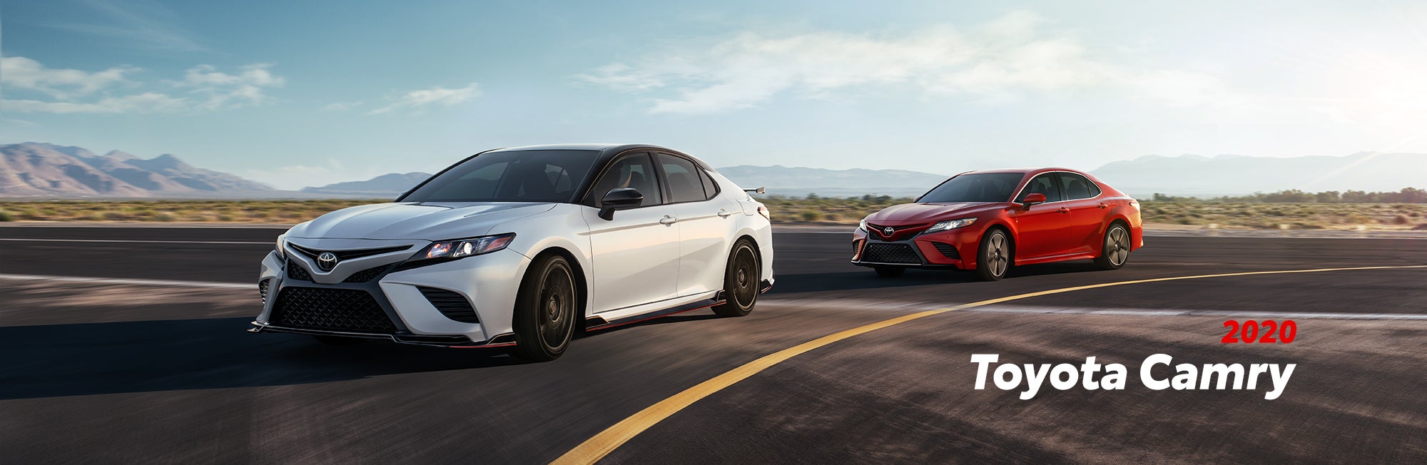 2020 Toyota Camry versus 2020 Honda Accord Comparison at Fiore Toyota | White and red 2020 Camry running on road
