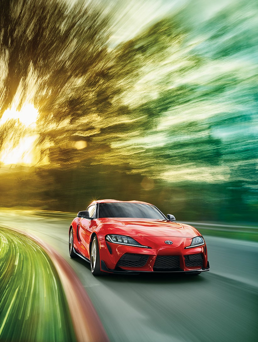 Performance features of the 2020 Supra at Fiore Toyota in Hollidaysburg | Red 2020 GR Supra running on road