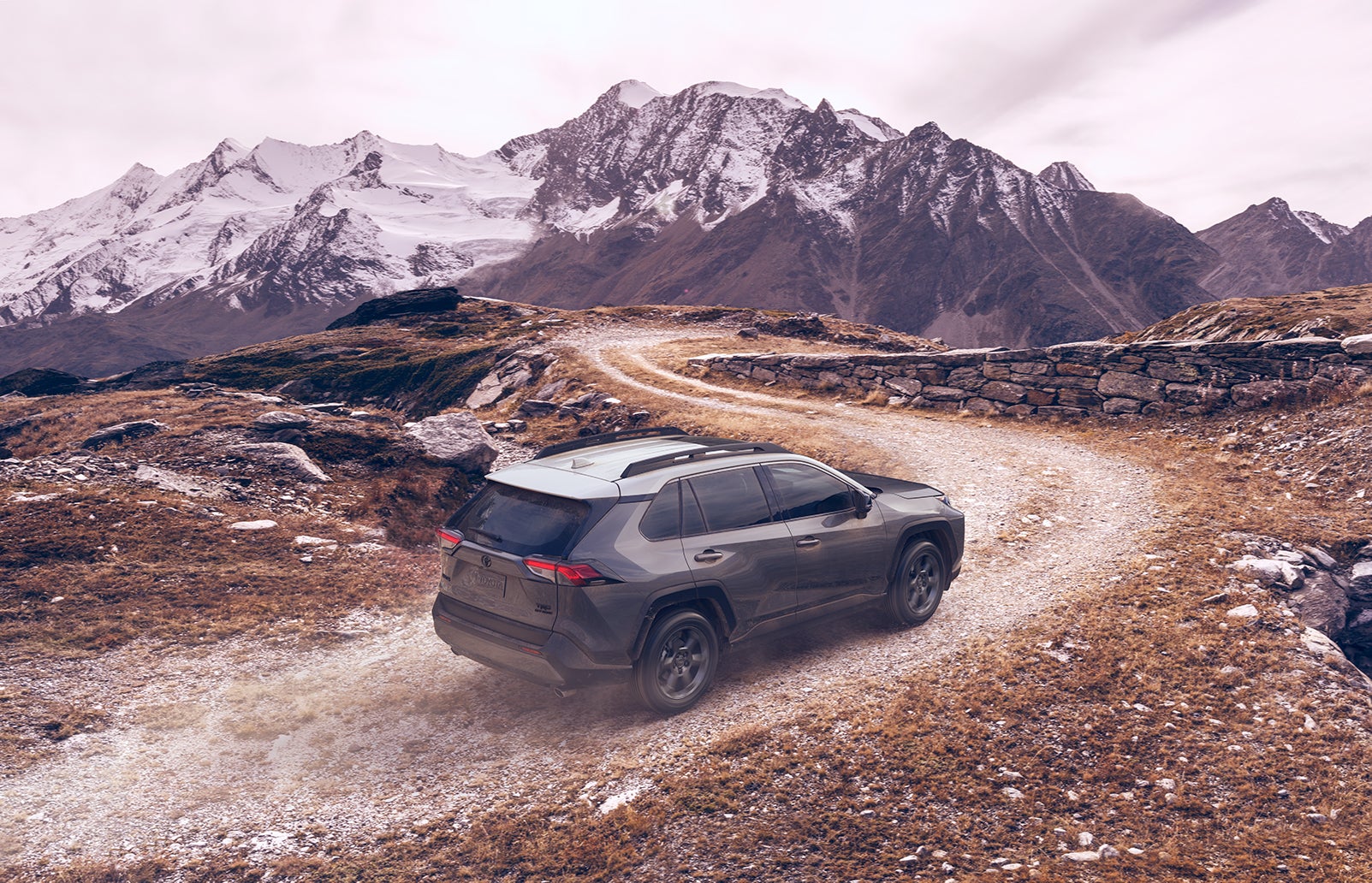 What you can get to personalize your vehicle at Fiore Toyota in Hollidaysburg | the grey 2020 RAV4 driving up the mountain