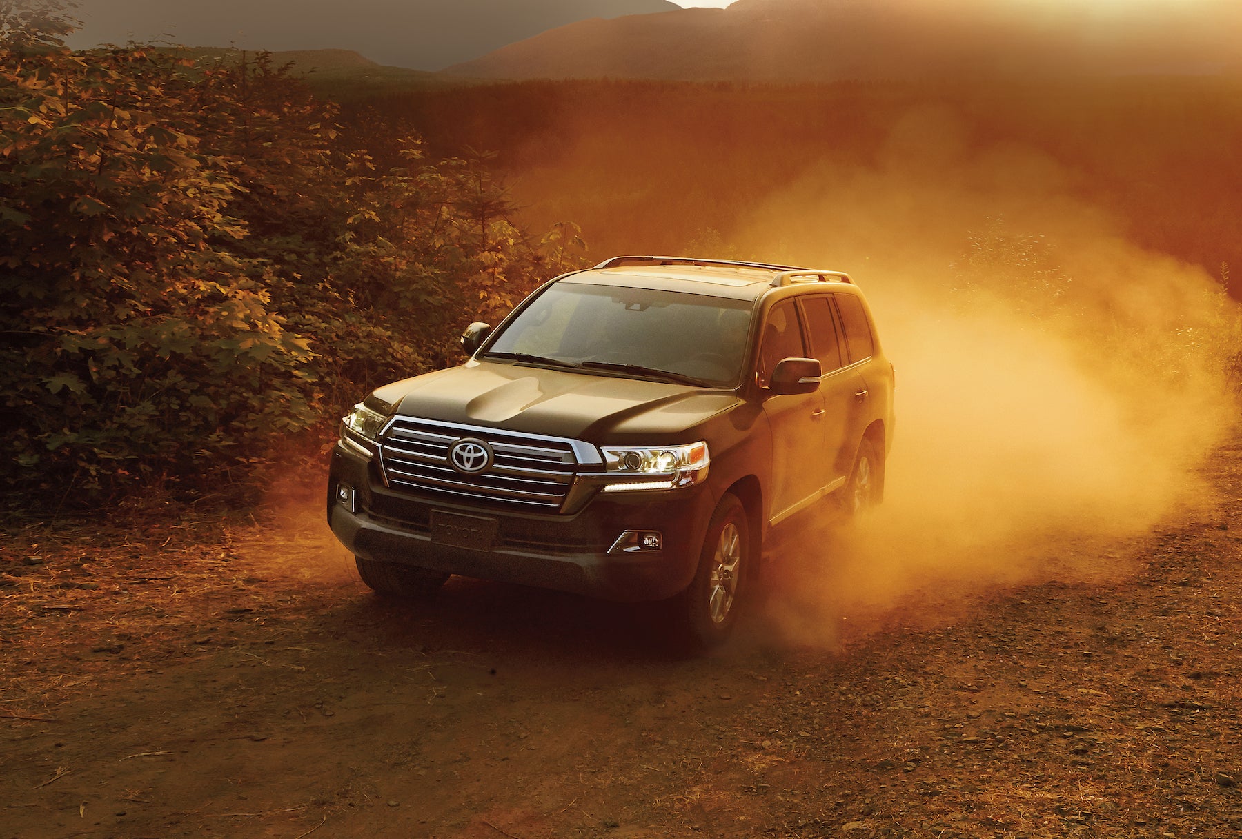 Accessories that help keep your Toyota protected at Fiore Toyota in Hollidaysburg PA | the 2020 black toyota sienna driving through dust cloud 