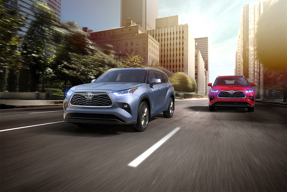 The 2020 Toyota Highlander coming soon to Fiore Toyota of Hollidaysburg | Blue and red 2020 toyota highlander running on road