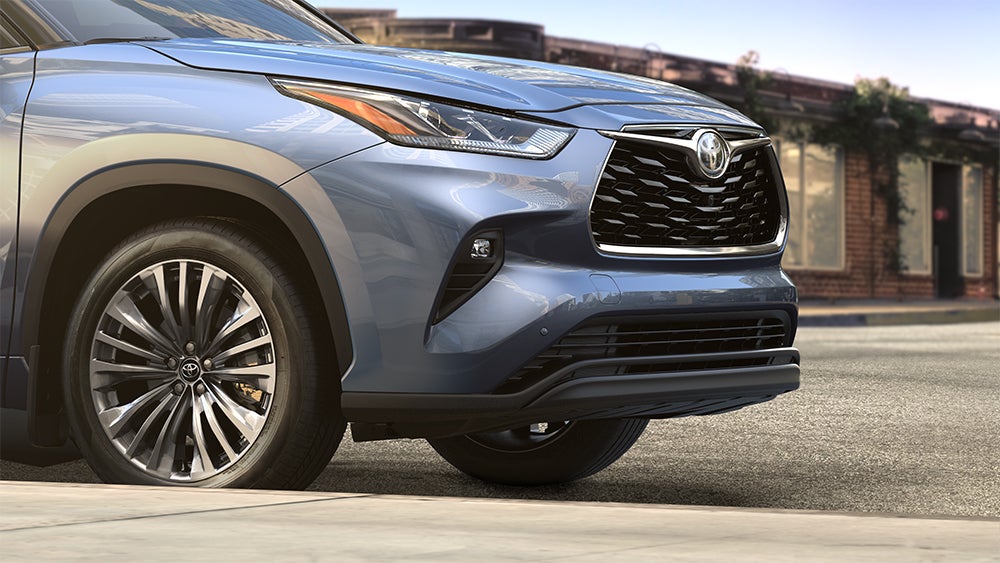 The 2020 Toyota Highlander coming soon to Fiore Toyota of Hollidaysburg | Blue 2020 toyota highlander parked on road